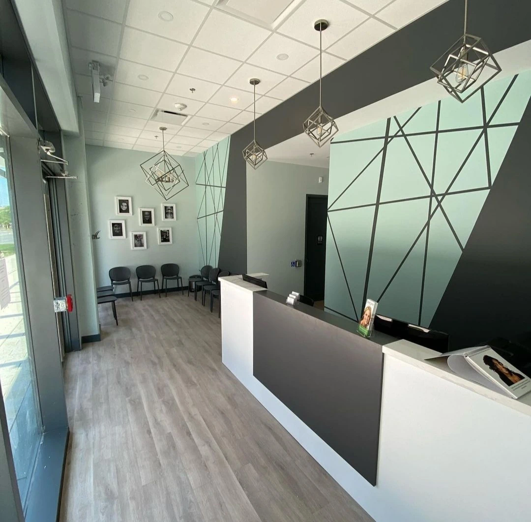 Modern commercial reception with geometric wall design